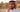 A close-up portrait from Five Season of a young Saudi man with clear, healthy eyes wearing contact lenses. He is standing outdoors in a warm, dusty desert environment with natural sunlight, highlighting eye comfort and premium lenses for dry climates
