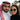 Saudi man and woman wearing luxury eyewear from Five Season Optical, featuring elegant prescription glasses and designer sunglasses in a modern outdoor setting in Saudi Arabia.